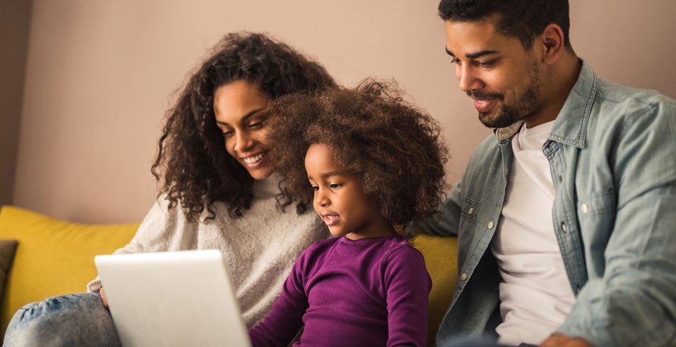 Family interacting with child's school information.